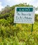 Humorous Road Sign Land of Rain That Makes One Hide Behind Rocks