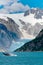 Humpback Whale Jumping Out of Water in Front of Glacier in Alaska