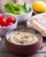 Humus in homemade bowl chapati and vegetable.