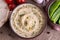 Humus in homemade bowl chapati and vegetable, top View.