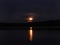 Hunbter`s Moon rises over Hinkley Reservoir in NYS