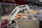 Hunched worker in a street work near an excavator in Doncaster.