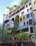 Hundertwasser House, Wien Artist`s creation of brightly painted, natural apartment block with a forested roof & balconies