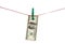 Hundred Dollars hang on clothes peg