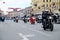 Hundreds of motorcyclists are riding along the main Avenue of the city