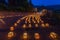 Hundreds of paper lanterns with candles, with long-exposure ghosts of people, at the annual Torigoe Ikkouikki Festival, Ishikawa