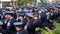 Hundreds of policemen stand outside at a church at a funeral for a policeman killed in a line of duty