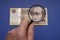 Hungarian 5000 forint banknote, on it Portrait of IstvÃ¡n Szechenyi. Examine through the magnifying glass.