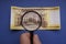 Hungarian 5000 forint paper money banknote. Examine through the magnifying glass.