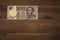 Hungarian forint 5000 forint banknote Count IstvÃ¡n Szechenyi. Brown wooden table.