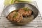 Hungarian mangalica burger with thyme in a brass pan