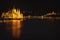 Hungarian Parliament Building located at the bank of Dunabe river with famous Chain Bridge connecting Buda and Pest in Budapest,