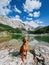 Hungarian Vizsla Dog on Rock by Mountain Lake