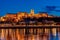 Hungary, Budapest at night, Buda Fortress illuminated by lights, reflected in the water