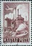 Hungary circa 1950: A post stamp printed in Hungary showing an industrial plant with chimneys and a propeller plane above it. Iron