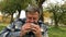 Hungry adult man, in casual dress, aged, eats hamburger.