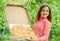 Hungry girl pizza box nature background, picnic time concept