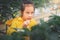 Hungry girl stealing strawberry in a strawberry farm