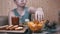 Hungry Kid Hand Takes Crispy Golden Potato Chips from Plate. Junk Food in Dinner