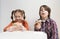 Hungry little kids eating Greek fast food for lunch. 9 year old girl with ponytails and 11 year old boy in plaid shirt enjoying