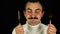 Hungry man with fork and knife on black background