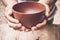 A hungry man holding an empty bowl