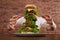 Hungry man with huge burger at wooden table