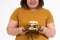 Hungry overweight young Asian woman holding hamburger on isolated background, Her hungry all time and overeat, gluttony and binge