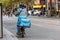 A Hungry Panda food delivery motorcycle driver is on his way to deliver food