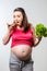 hungry pregnant woman chooses the unproductive food