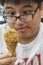 Hungry Teen Looking At Fried Chicken Drumstick