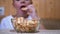 Hungry Teen Puts Chips From a Plate in Mouth at Home. Boy Eats Fast Food