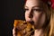 Hungry woman eating pizza