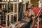 Hunky muscular black bodybuilder working out in gym