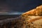 Hunstanton Cliffs at sunset with dark stormy sky