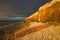 Hunstanton Cliffs at sunset with dark stormy sky