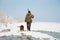 Hunter with his hunting dog during a hunt