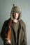 Hunter man fur winter hat holding rifle gun