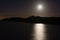 Hunters moon over sea at Sand Point