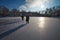 Hunters with weapons on the ice pond.