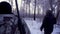 Hunters in the Woods. Armed Rangers in winter forest