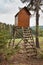 Hunting hide in the forest. Hunting stash. The wooden tower.