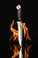 Hunting knife with fire on a black background