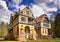 Hunting lodge under sky with clouds in the forest in yellow sands. Gelbensande, Germany