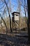 Hunting and observation wooden tower in the forest in March. Berlin, Germany