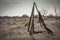 Hunting shotguns in dry rural field in overcast day with dramatic sky during hunting season as hunting background with copy space