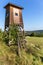 Hunting tower in nature,Czech Republic. Lookout tower for hunting in summer day. Agricultural landscape in the Czech Republic. A
