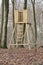 Hunting tower, wooden treehouse and observation structure in a forest or remote countryside woods. Timber wood lookout