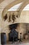 Hunting trophies hanging on the kitchen wall in Castelnaud Castle, medieval fortress at Castelnaud-la-Chapelle, Dordogne, Aquitain