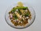 Hurda, Tender Jowar or Sorghum Bhel served in a bowl with green chilly and lemon. Selective focus